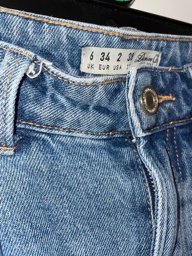 Distressed blue jeans
