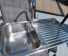 Kitchen sink and tap