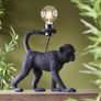 Black monkey table lamp. Image 2