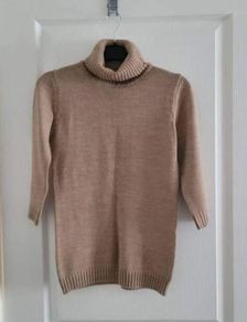 carmel and black turtleneck