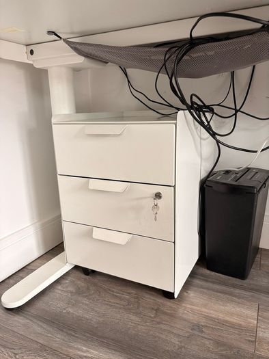 Electric sit to stand desk,chair and cabinet.