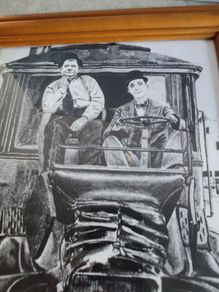 Laurel and Hardy driving framed Print black and white.
