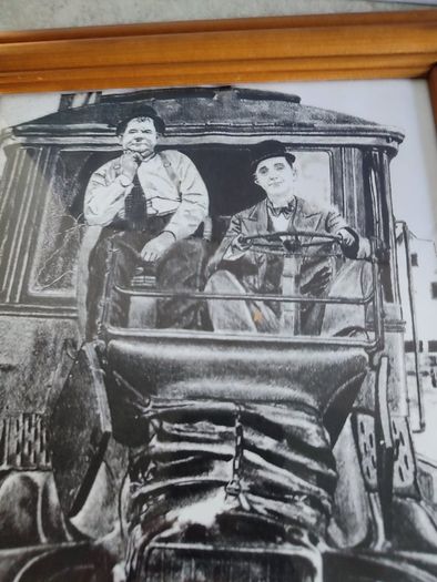 Laurel and Hardy driving framed Print black and white.