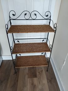 antique shelf unit metal and weave . Shelves clip out and frame folds for easy transport