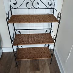 antique shelf unit metal and weave . Shelves clip out and frame folds for easy transport