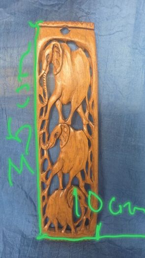 Hand-carved wooden elephant wall hanging