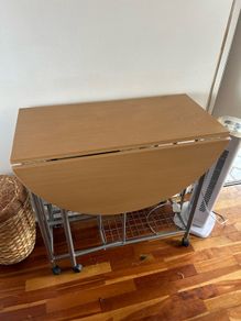 small kitchen table on wheels and with storage