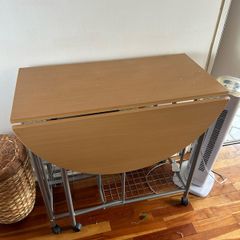 small kitchen table on wheels and with storage