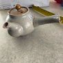 Japanese Side-Handle Teapot Kyusu 300cc  speckled ceramic side-handle teapot (kyusu) features a hand-painted pink cherry blossom (sakura) or plum floral branch motif against a light gray or cream stoneware body Image 2