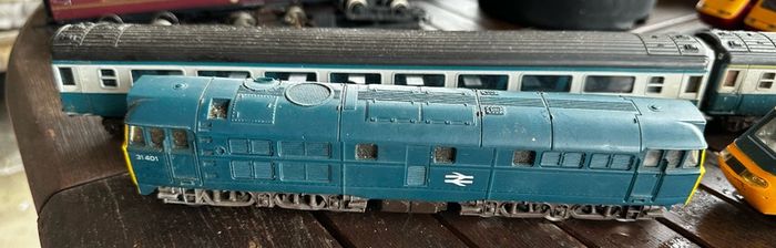 2 Hornby British rail engines and 2 British rail coaches. Don't have a controller so don't know if they work or not Hornby train