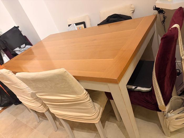 Dining table with wooden top and painted legs