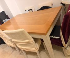 Dining table with wooden top and painted legs