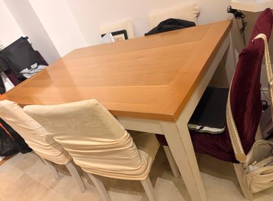 Dining table with wooden top and painted legs