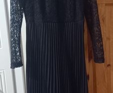 ladies black pleated dress with mesh sleeves
