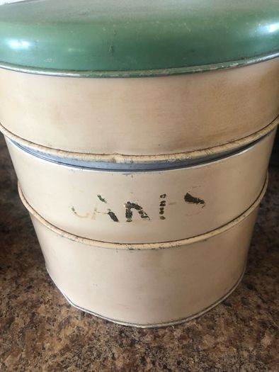 selection of vintage cake storage tins with lids