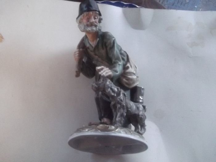 a lovely figurine of the man of the road