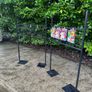 Black Grid Wall Shop Display Stand - Signage Space Above Image 2