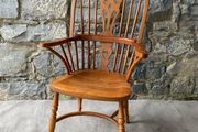 A large oak Windsor armchair.
