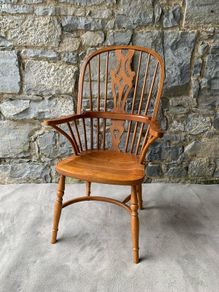 A large oak Windsor armchair.
