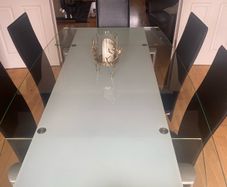 Glass & Chrome Dining Room Table with 6 Black leather and Chrome Chairs
