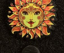 Sun,   pin back badge.