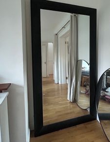 Meadows and Byrne tall leaning black wooden mirror