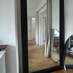 Meadows and Byrne tall leaning black wooden mirror
