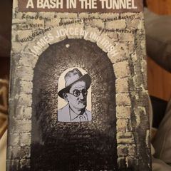 A Bash In The Tunnel. Edited By John Ryan. First Edition Hardback With Dustjacket In Good Condition.