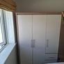 Timer and white wardrobe and bedside locker Image 3