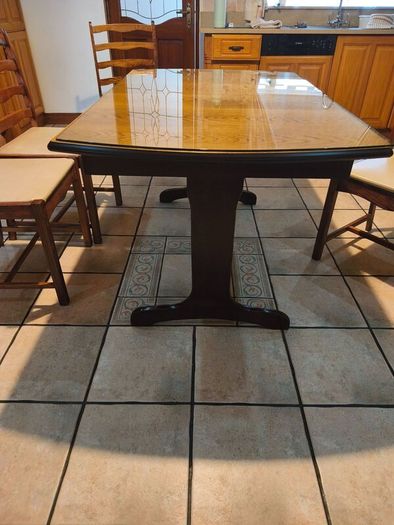 Dining table with glass top and four chairs