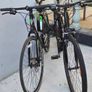 Two bikes one mountain one is a type of racing mountain bike Image 2