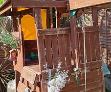 Garden playhouse slide swing