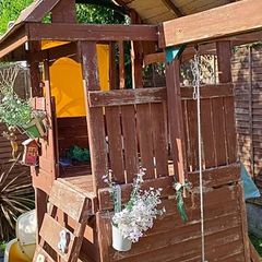Garden playhouse slide swing