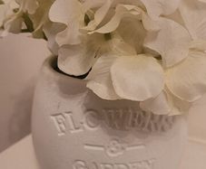 Faux Flowers In Ceramic Pot