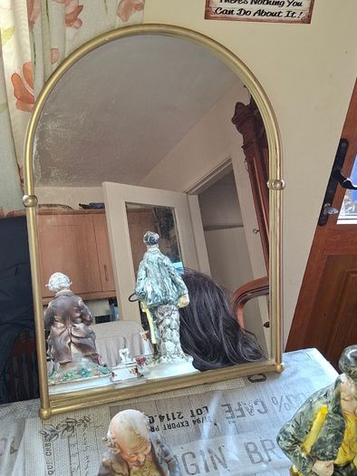 Beautiful Late 20th century Arched Brass Colored Metal Wall Mirror, the arched plate within tubular uprights with spherical finials. Collection is Preferred