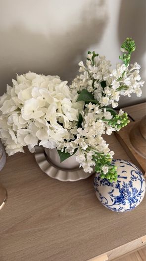 Beige pot with faux flowers