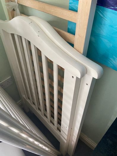 White wooden cot