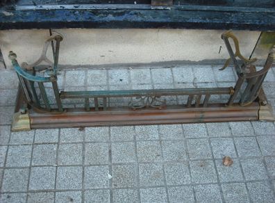 a antique solid brass fender 4 foot long