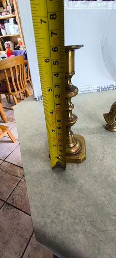 2 BRASS ITMEES-1- Primitive Antique Early Country Brass Push Up 9.5 INCHES Candlestick55.00 euro. 2- Brass Oliver Plunkett Tapper or papper wighte 60.00 euro.