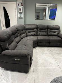 Corner sofa with electric recliners