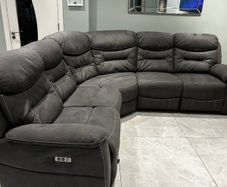 Corner sofa with electric recliners