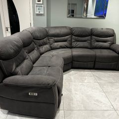 Corner sofa with electric recliners