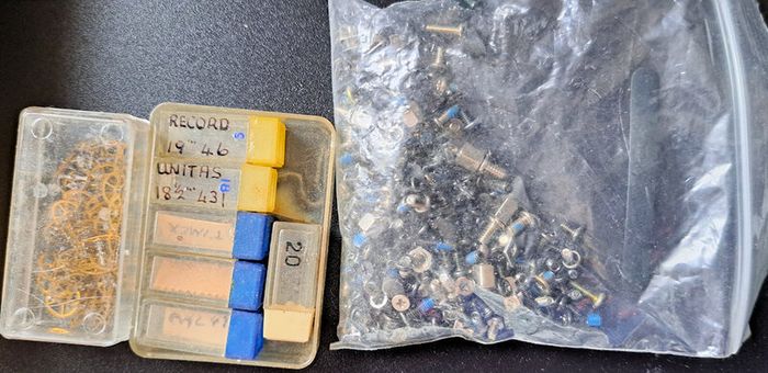 Boxes of miscellaneous watch parts