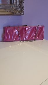 Brand new,  unused Pink Pvc and chrome clutch bag