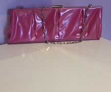 Brand new,  unused Pink Pvc and chrome clutch bag