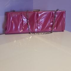 Brand new,  unused Pink Pvc and chrome clutch bag