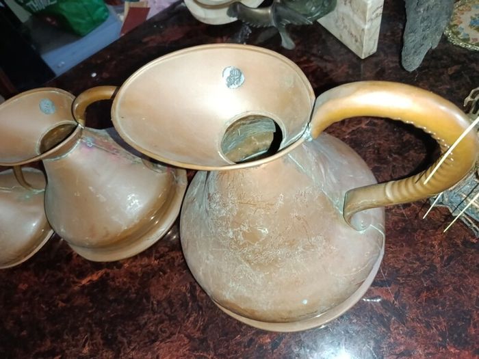 Antique Haystack copper jug set of 7
