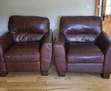 Brown leather armchairs