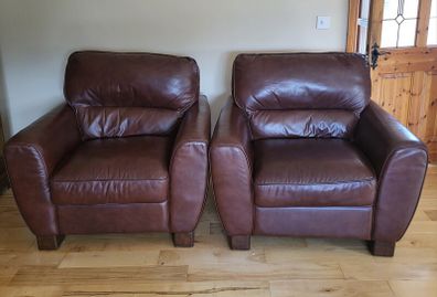 Brown leather armchairs