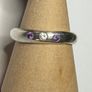 Handmade sterling silver ring with flush set stones. Size O Image 2